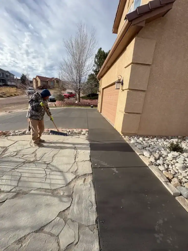 CrestStone Concrete professional pouring and finishing a new concrete driveway.