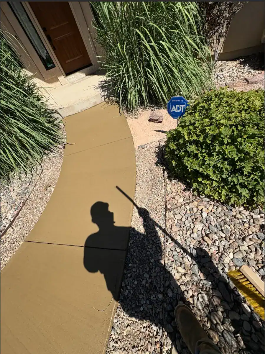 Colored concrete entry steps with stone veneer